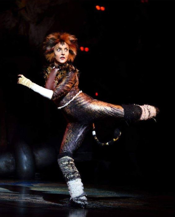 Rachel Angus performing dramatically on stage.